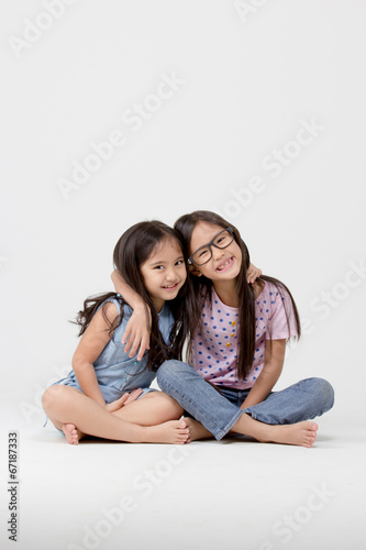 Portrait of little cute Asian girl on isolated background © RedcupStudio