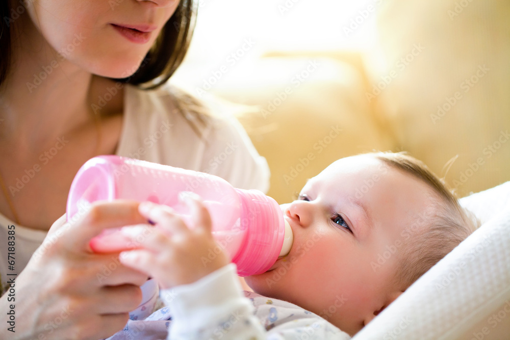 mother feeds baby