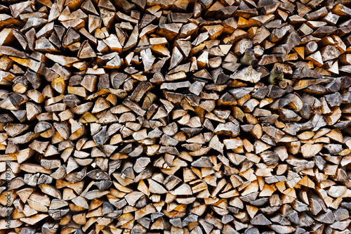 The Background of stack of old firewood