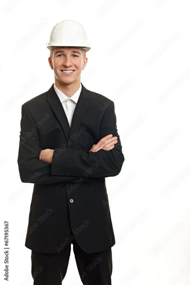 Young businessman in suit with a protective helmet on head Young businessman in suit with a protective helmet on head