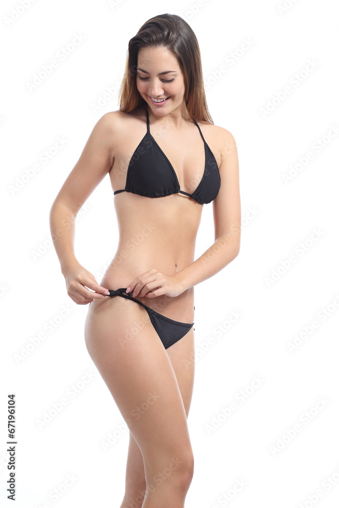 Sunbather beauty fitness woman putting on a bikini Stock Photo | Adobe Stock