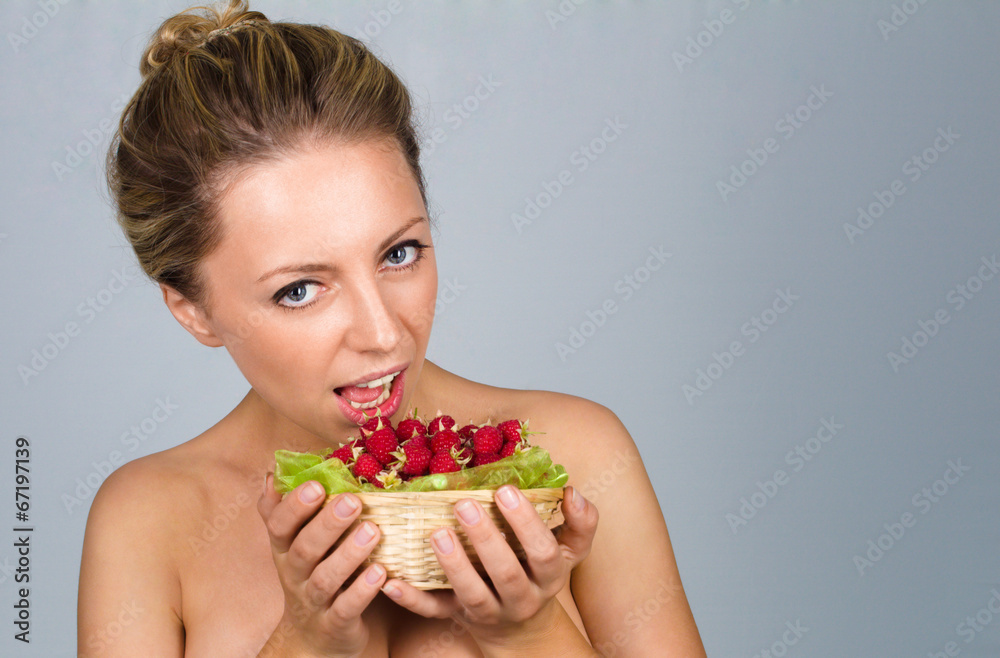 Woman holding raspberries Woman holding raspberries