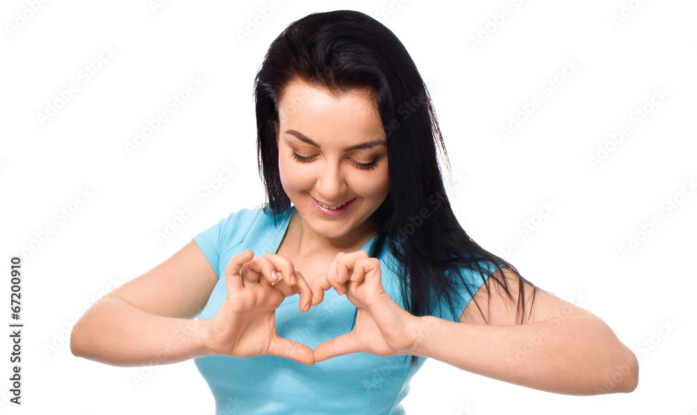 Beautiful young woman showing heart symbol gesture Beautiful young woman showing heart symbol gesture
