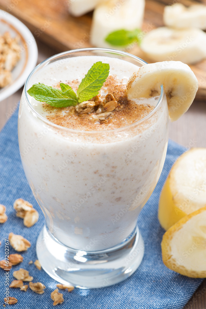 milkshake with banana, granola and cinnamon, close-up milkshake with banana, granola and cinnamon, close-up