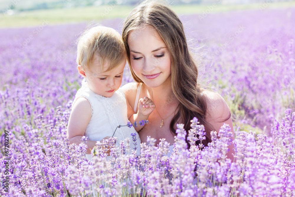 Mother and gaughter playing in lavender field Mother and gaughter playing in lavender field