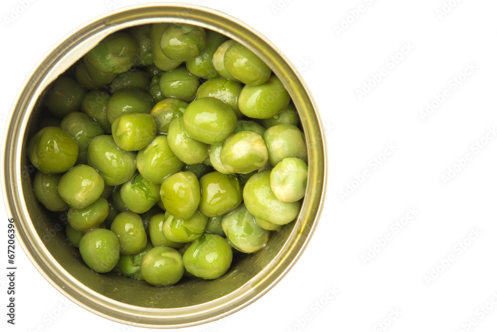 Green peas in a tin can over white background Green peas in a tin can over white background