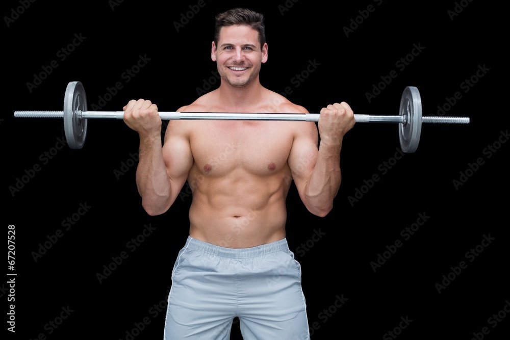 Smiling crossfitter lifting up barbell Smiling crossfitter lifting up barbell