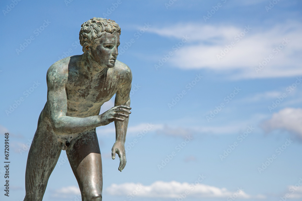 A statue of 'The Runner' in the garden of Achilleion in Corfu.