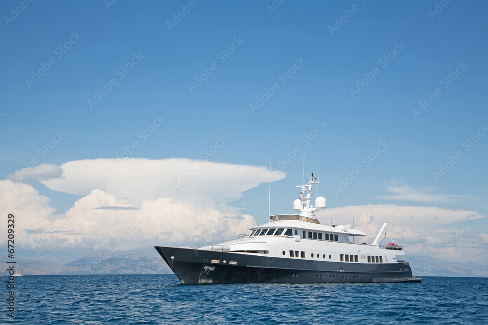 Luxury large super or mega motor yacht in the blue sea.