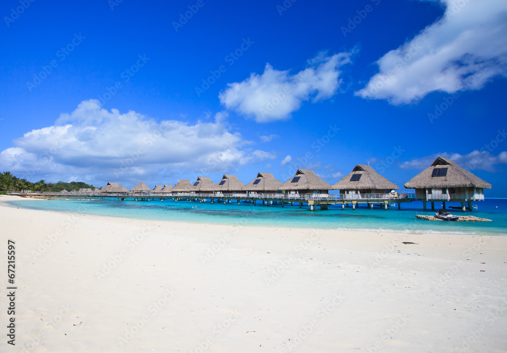 White sand beach and overwater villas in  Bora Bora