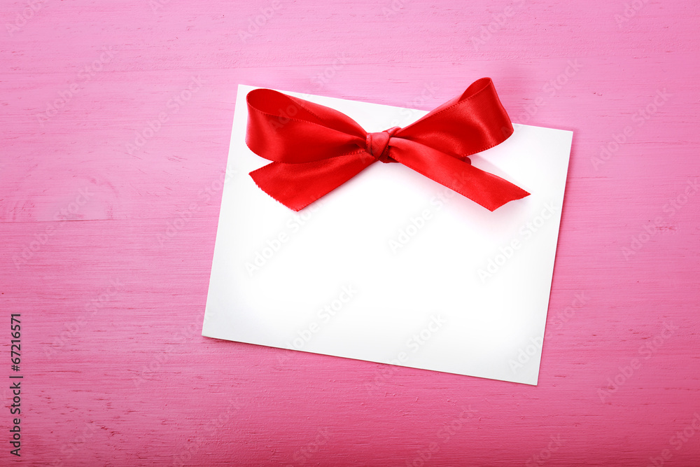 Blank message card on pink wooden board Blank message card on pink wooden board