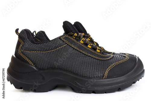 Black working boots with yellow thread on white