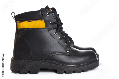 Fotografija The high work black leather boots on white background