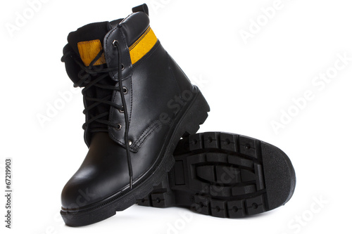 Slika na platnu The high work black leather boots on white background