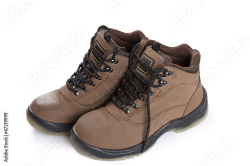 New brown working boots on a white background.