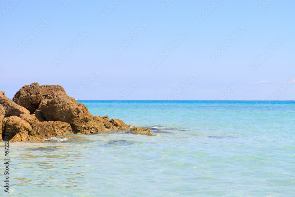 Color DSLR image of rocks in the clear, shallow water on South Beach, Miami, Florida
