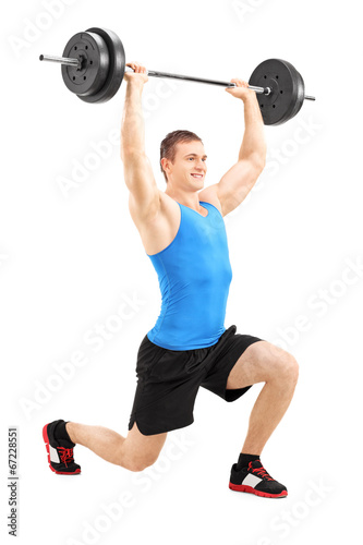 Man lifting a barbell and doing lunges