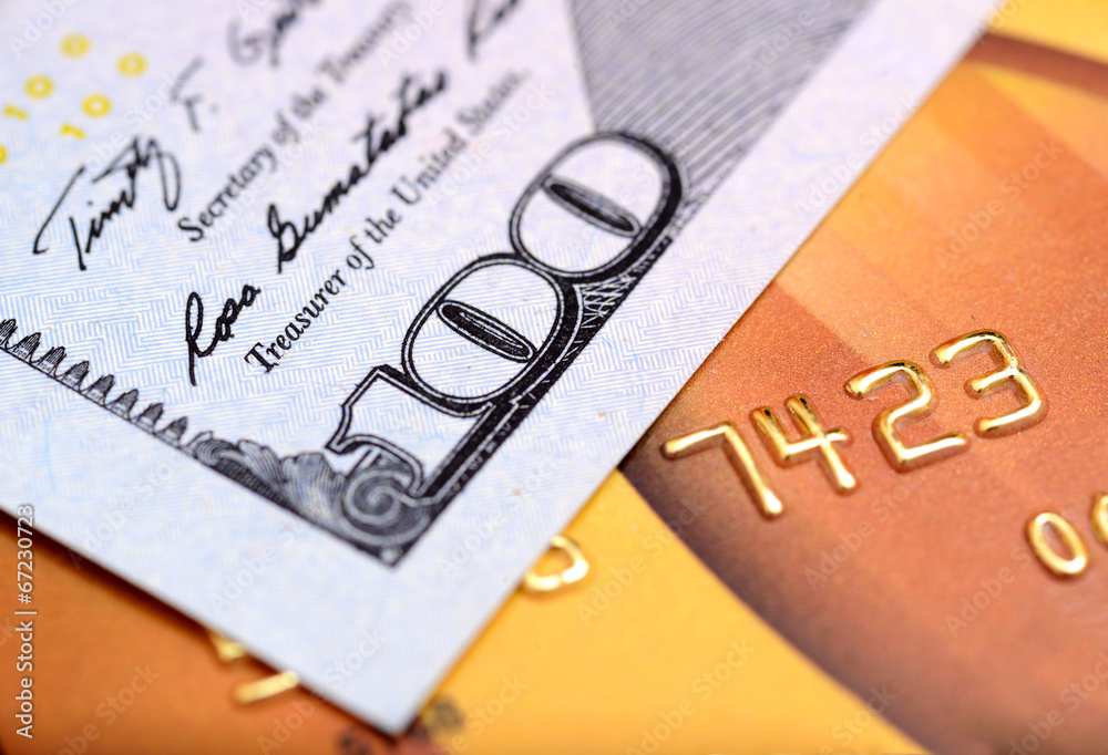Close-up dollar note on credit card with shallow depth of field Close-up dollar note on credit card with shallow depth of field