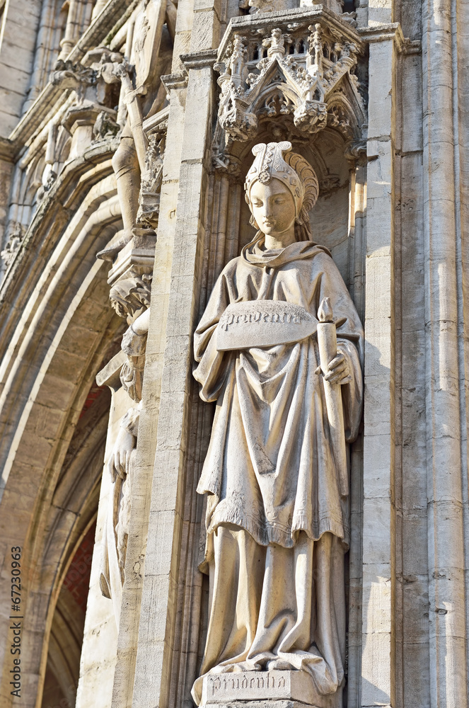 statue of Prudence on medieval facade of City Hall