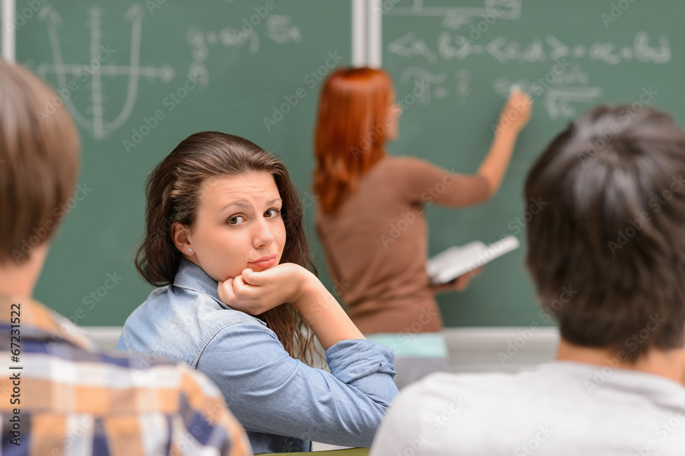 Bored student girl during math lesson Bored student girl during math lesson