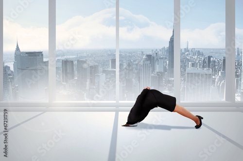 фотографія Composite image of businesswoman burying her head