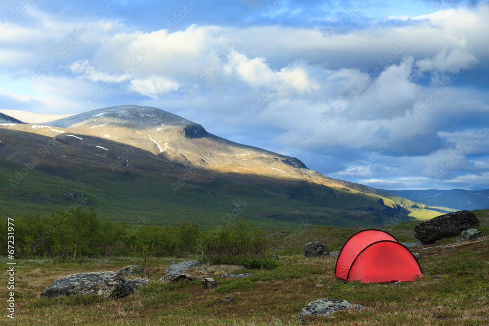 Red tent in the mountains of Lapland, Sweden.
