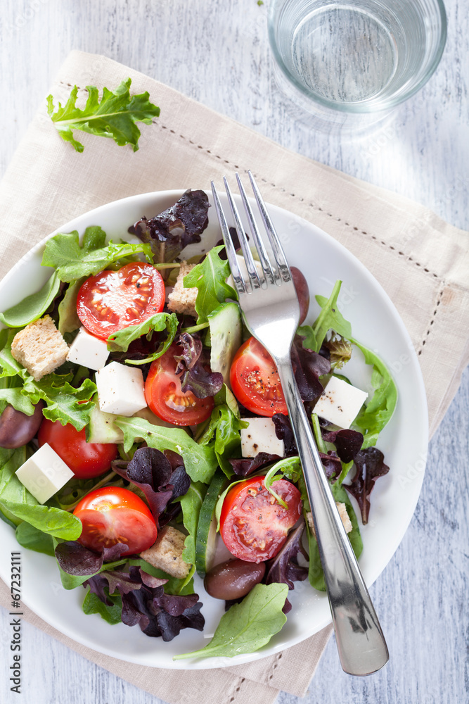 healthy salad with tomatoes olives and feta cheese healthy salad with tomatoes olives and feta cheese