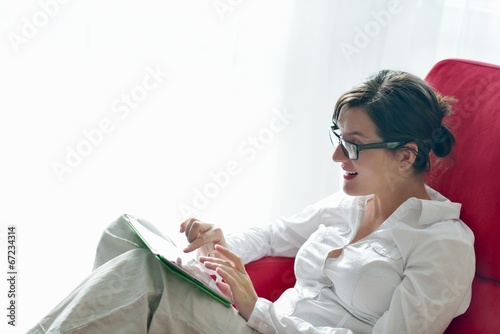woman using tablet pc at home