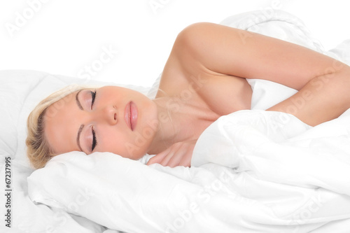 Young beautiful woman sleeping in bed