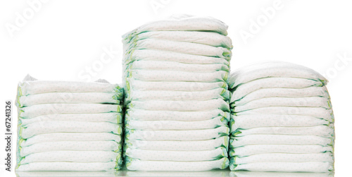 Three stacks of diapers