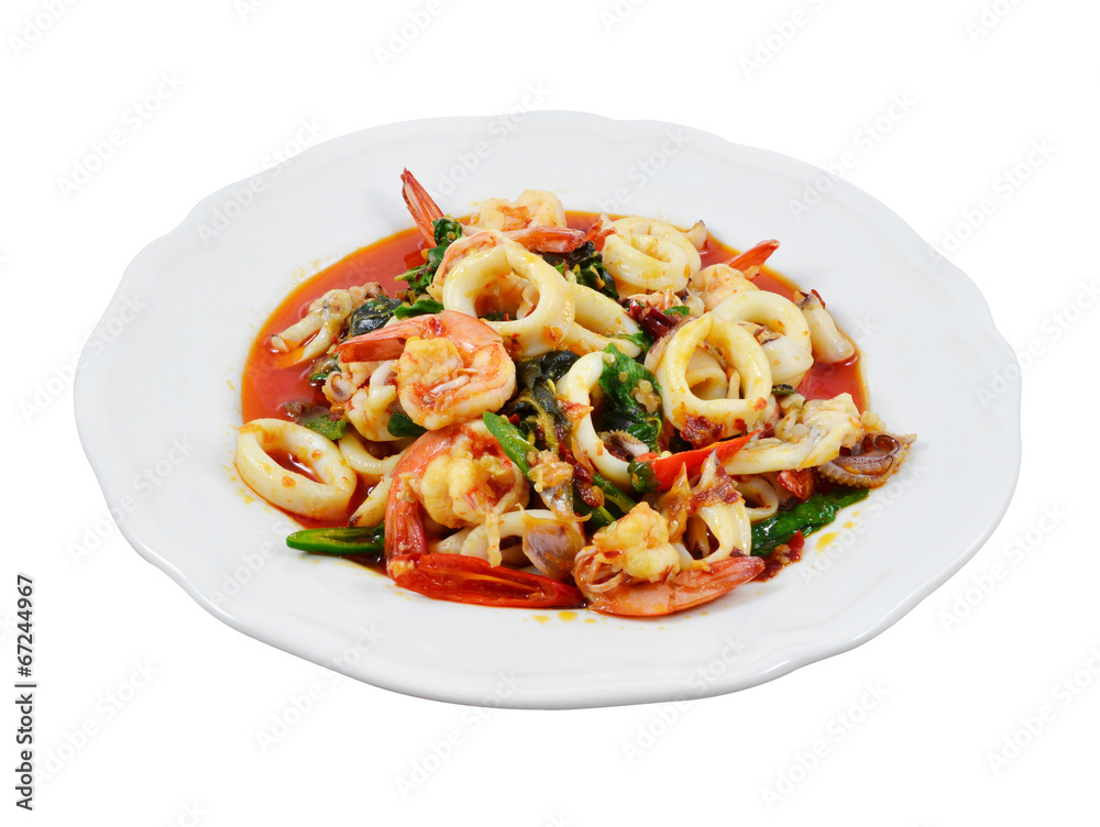 Thailand food, shrimp and squid stir-fried peppers and basil.