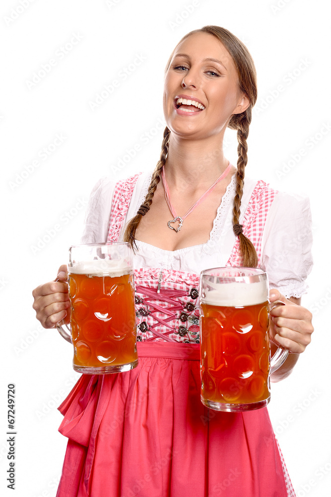 Lachende junge Frau im Dirndl serviert Bier Lachende junge Frau im Dirndl serviert Bier