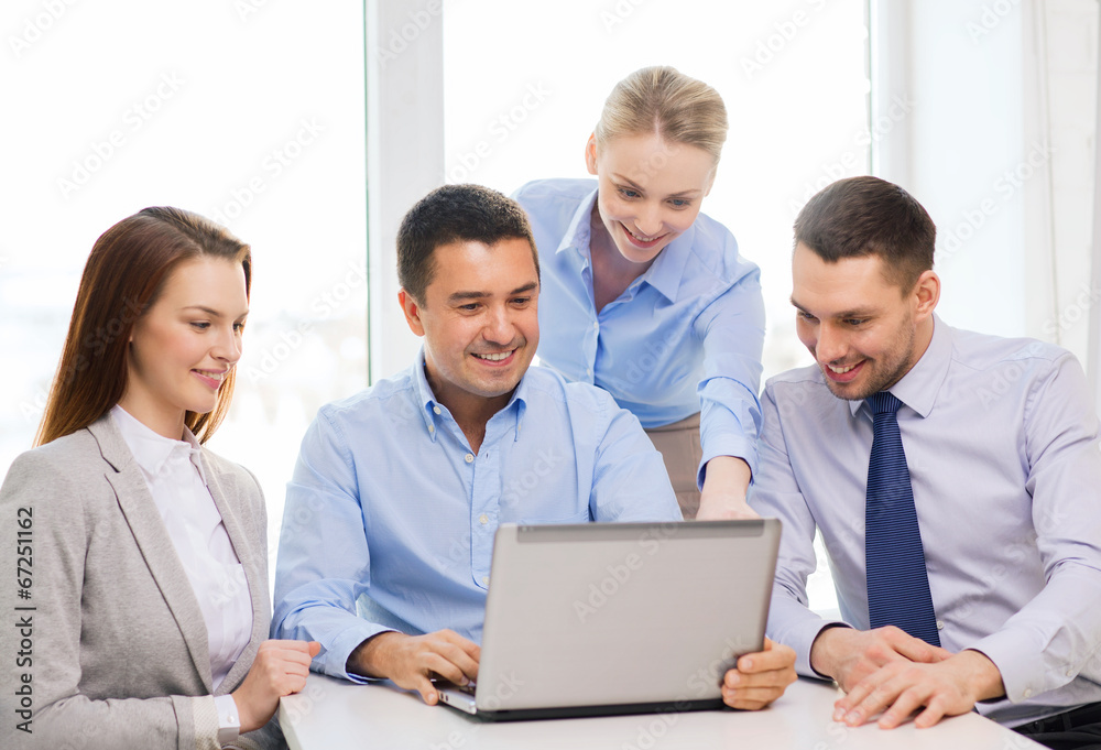 business team working with laptop in office business team working with laptop in office