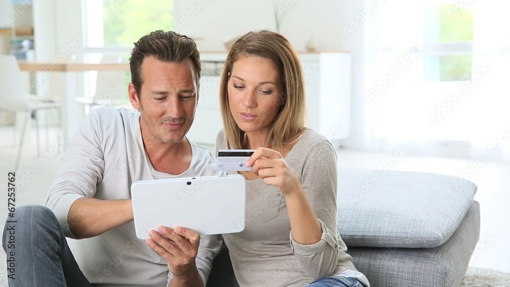 Couple at home buying on internet Couple at home buying on internet