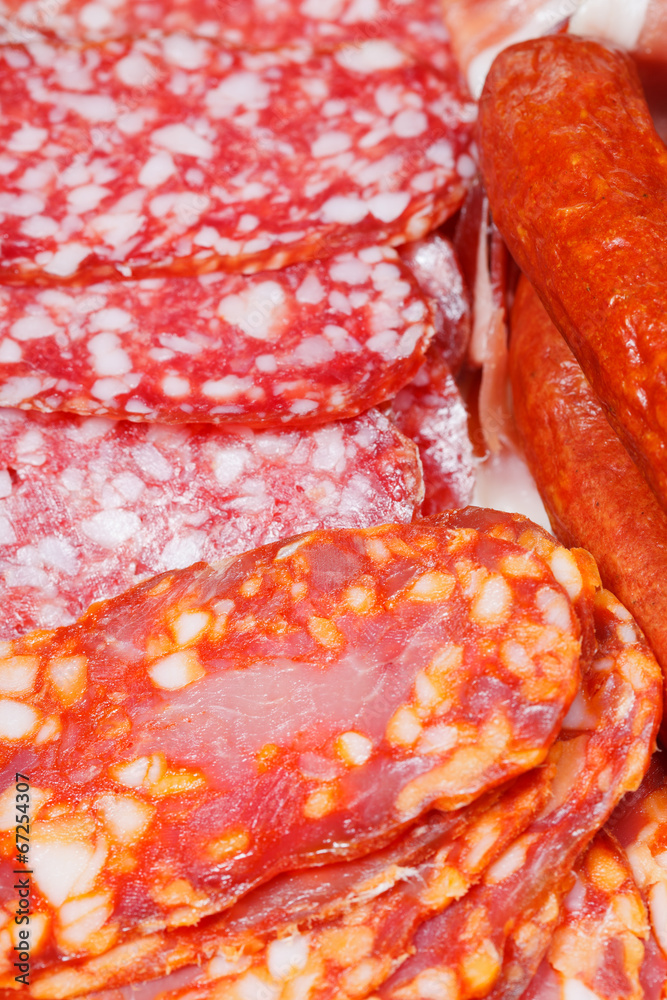 various sliced sausages on plate various sliced sausages on plate