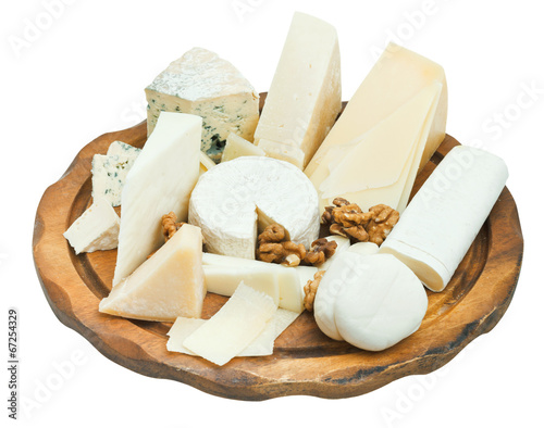wooden plate with various cheeses