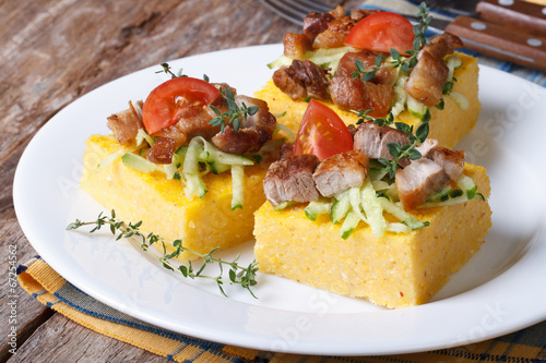 Slices of tasty polenta with meat and vegetables