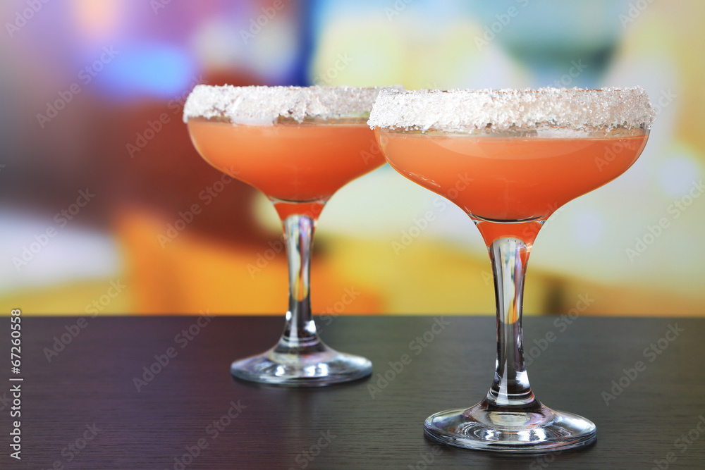 Grapefruit cocktail in glasses on bright background Grapefruit cocktail in glasses on bright background