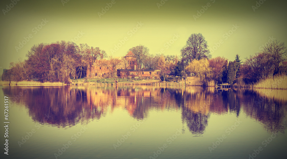Vintage picture of Bierzwnik village by the lake, Poland.