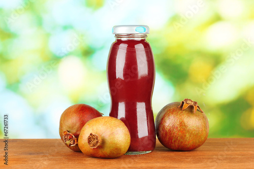 bottle of pomegranate juice and pomegranates