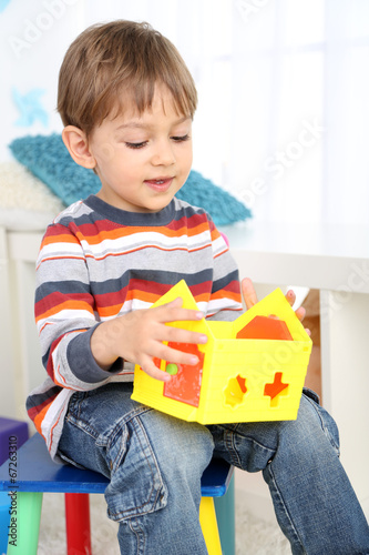 Cute little boy playing in ...