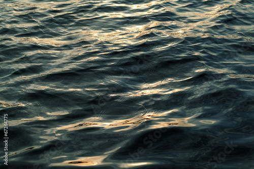 Water with waves at sunset