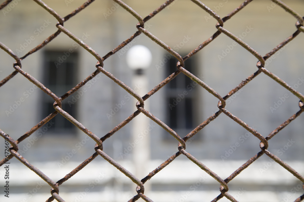 rustic metal chainlink fence with a window and light pole in bac rustic metal chainlink fence with a window and light pole in bac