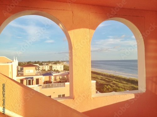 view of seaside framed be windows