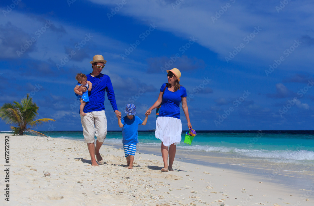 family with kids on tropical beach
