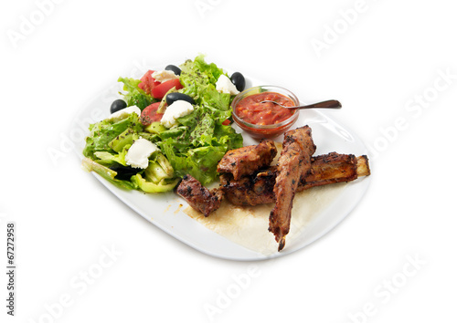 the ribs on the grill with salad