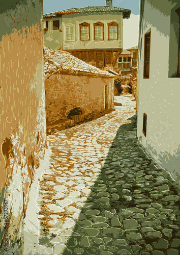 Old street with paving stones expensive. Greece, Kastoria