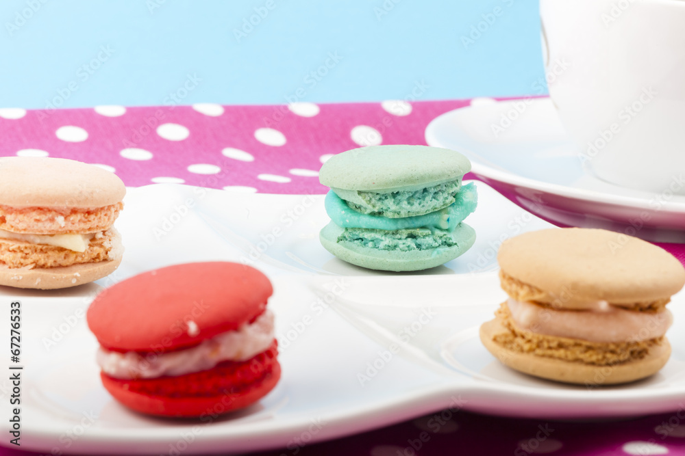 Sweet and colorful French macaroons on pastel background