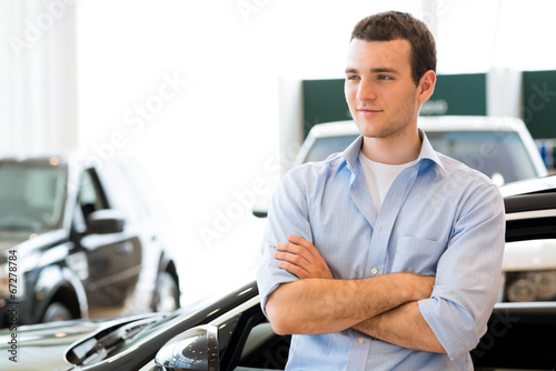 man standing near a car