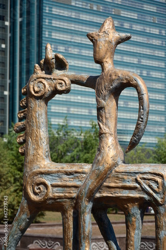 A bronze statue featuring a rider on horseback
